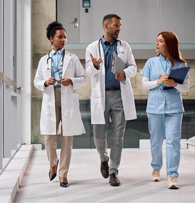 team of doctors walk together