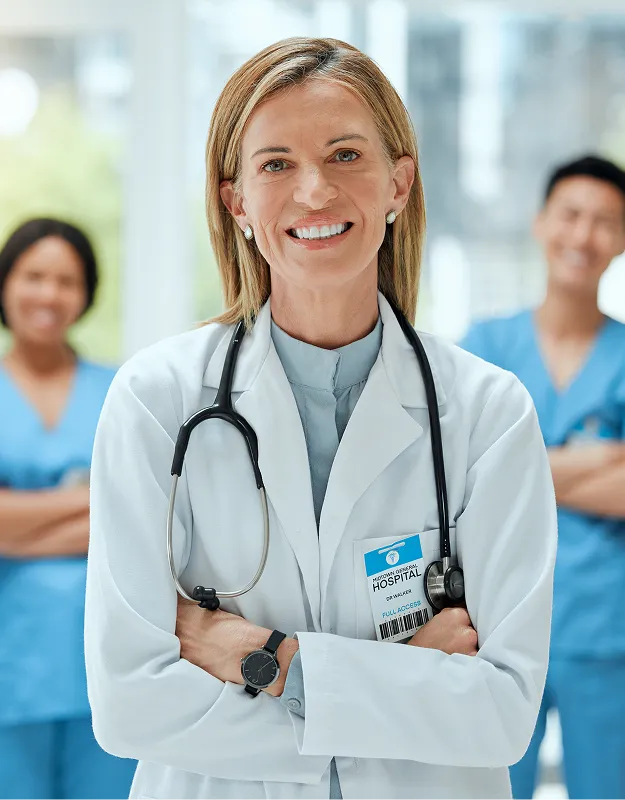 A lady doctor stand with team